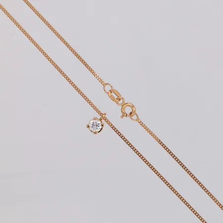 Hänge med diamant ca 1 x 0,35ct, Ø 5mm, kedja Pansar längd ca 42cm, bredd 1,2mm, 18K Vikt: 3 g