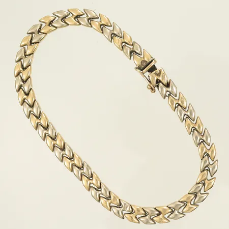 Armband tvåfärgat längd 21cm, bredd 6,5mm, slitet, buckligt, 14K, 11,3g Vikt: 11,3 g