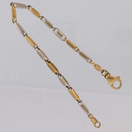 Armband tvåtonat längd 19,5cm, bredd 3,2mm, ostämplat, 18K Vikt: 14,8 g
