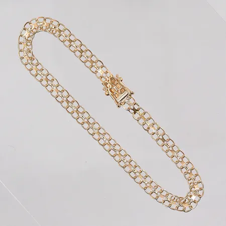 Armband X-länk längd 19½cm, bredd 5mm, 18K. Vikt: 5,3 g