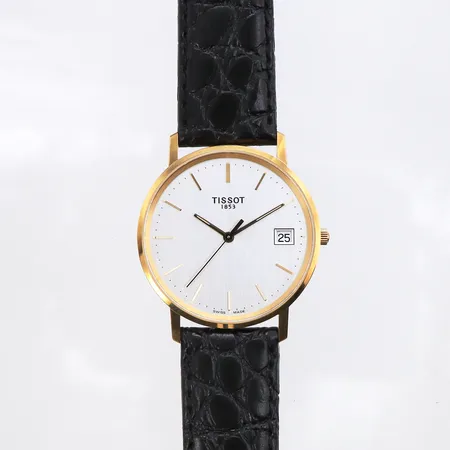 Herrur Tissot 18K, 33,5mm, quartz, gravyr, läderband batteribyte krävs, inga tillbehör