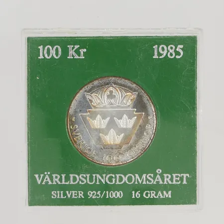 Minnesmynt Världsungdomsåret, 1985, nominellt värde:100kr, etui 925/1000 Silver 16,0g.