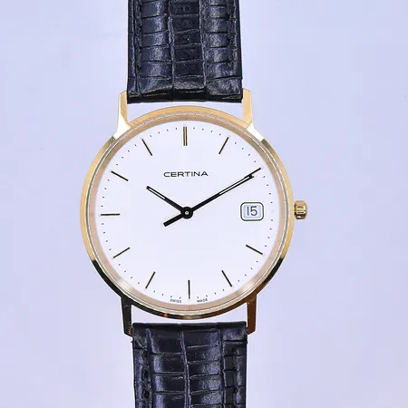 Herrur Certina quartz Ø33 mm datum, graverad boett etui medföljer 18K.