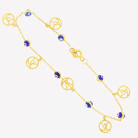 Armband blå öga längd 19-19,5cm bredd 1-9mm OBS! Ej märkesdesign 21K. Vikt: 2,6 g