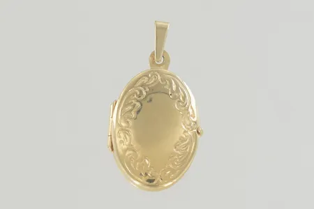 Hänge medaljon längd 3 cm bredd 1,5 cm 18K   Vikt: 2,8 g