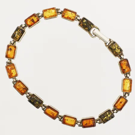 Armband med flerfärgad bärnsten längd 20,5cm, bredd 6,2mm Silver 925/1000 Vikt: 11,1 g