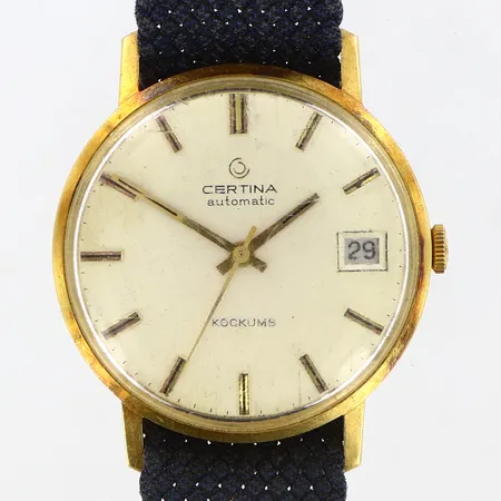 Herrur Certina automatiskt Ø34mm i 18K, datum, Kockums, tygarmband, bruttovikt: 39,1 gram