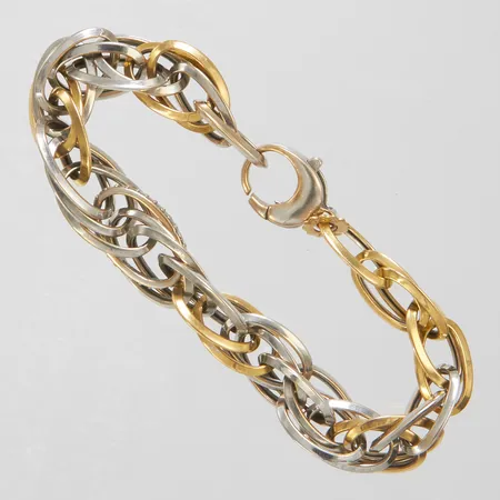 Armband med vita stenar längd 20cm, bredd 11mm, tvåfärgad, färgbortfall på lås, 18K Vikt: 23,9 g
