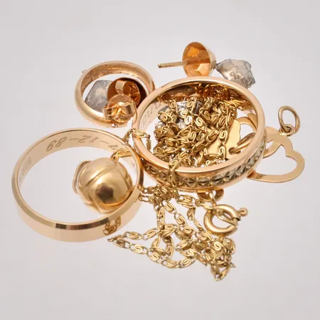 Diverse defekt guld, 18K, 14,08g.