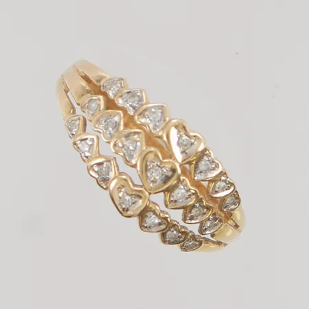 Ring med diamanter 21x ca 0,0025ct stl:18 bredd 9mm 18K 2,0g.