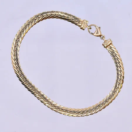 Armband längd 18,5 cm, bredd 5 mm 18K. Vikt: 5,9 g