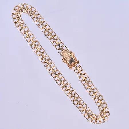 Armband X-länk längd 17,5 cm, bredd 5 mm 18K. Vikt: 5,8 g