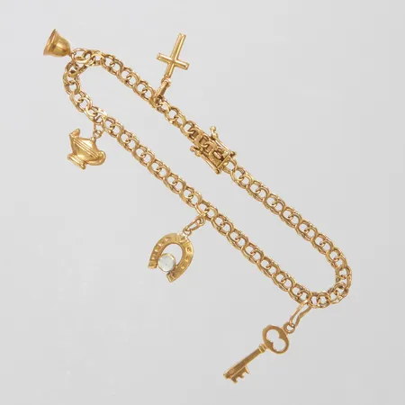 Armband Bismarck med integrerade berlocker längd 18,5cm, bredd 4-30mm, 18K Vikt: 8,4 g