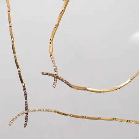 Set Collier längd 42cm, Armband längd 18,5cm, små vita och färgade stenar, 21K Vikt: 24,7 g
