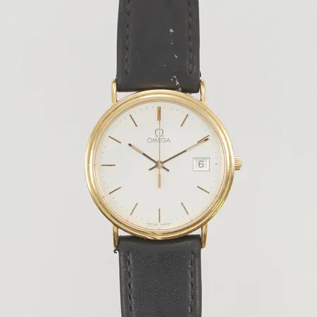 Herrur Omega 18K 32mm quartz boettnr:1687500 Kaliber 1530 läderband ej original, går ej, batteribyte krävs, originalbox.