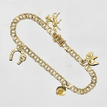 Armband Bismarck med 4 berlocker längd 18½ cm, bredd 5 mm, 18K. Vikt: 9,7 g