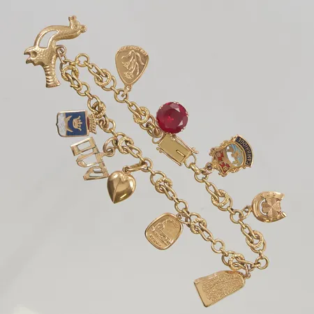 Armband 19,5cm bredd 6mm (3 berlocker i 14K)18K 18,5g.
