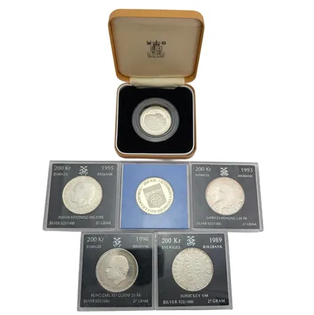 Mynt 200 kr, 4 stycken,  925/1000, lokalmynt Bromölla 100 kr 925/1000, mynt 5 dianarer, Jemen, 925/1000, total finvikt cirka 130g