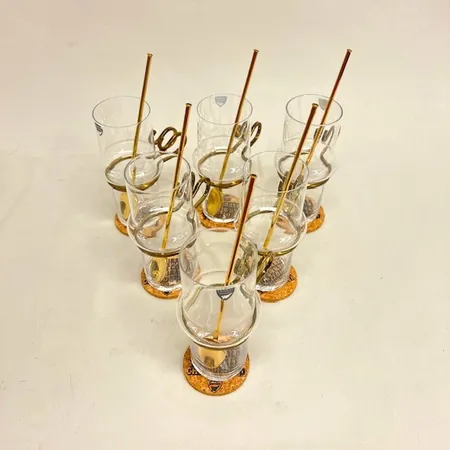 6 Irish coffee-glas, höjd 14cm, mässingsbeslag, etikettmärkta Orrefors, 6 mässingsskedar, 6 korkunderlägg  Skickas med paket.