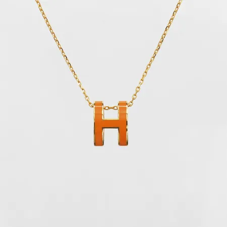 Collier Hermès, Mini Pop H, guldfärgad metall och orange emalj, längd ca 40cm, ref-nr: H147991F, serie-nr: ST0251, kvitto, reseetui, etui.