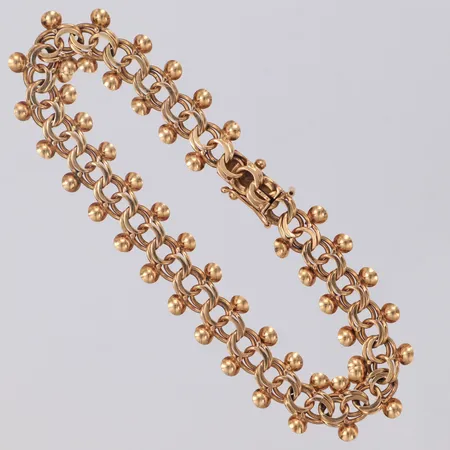 Armband Bismarck med droppar längd 18,5mm bredd 11,0mm låsåtta saknas, ojämnheter 14K Vikt: 11,1 g