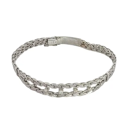 Diamantarmband, 18K vitguld, Diamanter 7 x 0,01-0,05ct, gammalslipade, UnoAerre Italien, svensk kontrollstämpel, längd knäppt 21,0 cm, bredd 6-9 mm Vikt: 24,2 g