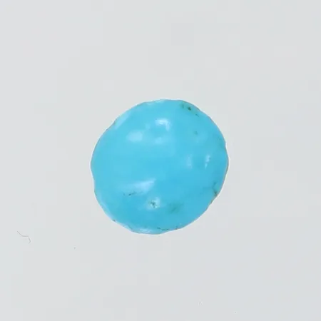 Lös cabochonslipad turkos ca 7,75x7,15x3,4mm ca 1,50ct nagg/skador.  Vikt: 0 g