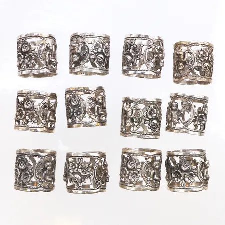 12 Servettringar, 835/1000 silver. Vikt: 146,9 g