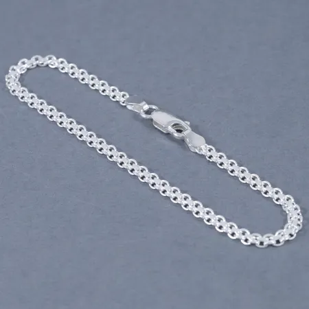 X-länksarmband i silver. Längd 19 cm. Bredd 3,2 mm. Karbinhake. Stämplat 925. Framstår oanvänt. Vikt 3,5g.