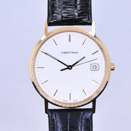 Herrur Certina quartz datum Ø34 mm, graverad boett nyskick 18K.