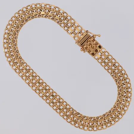 Armband X-länk längd ca 21,5cm bredd 8,6mm Esto Ab Guldvarufirman år 1965 Stockholm 18K  Vikt: 17,1 g