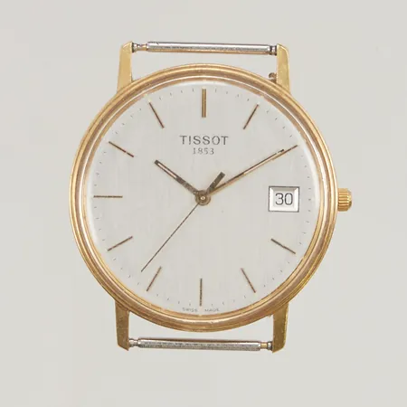 Herrur Tissot 18K, 33,5mm, quartz, går ej, graverad,  Vikt: 8,5 g Skickas med postpaket.