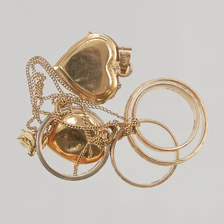 Diverse guld skador och gravyr finns18K 18,3g.