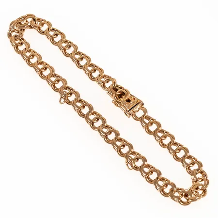 Armband Bismarck 21,5cm bredd 6,3mm, två öglor från berlocker sitter kvar, 18K 13,9g. 