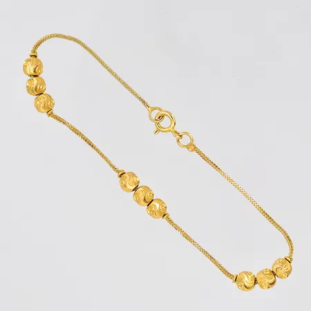 Armband längd 18,5cm kulor Ø 5mm 21K Vikt: 3,7 g