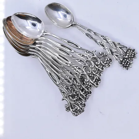 14 skedar längd9 och 9,5 cm, silver 830/1000. Vikt: 91 g