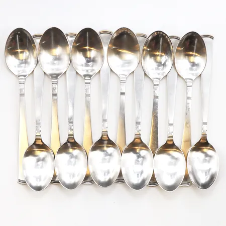 12 Efterrättsskedar modell Rosenholm, 830/1000 silver, orginal förpackning. Vikt: 295,5 g