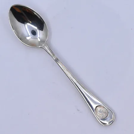 7 skedar längd 12 cm, silver 830/1000. Vikt: 104,2 g