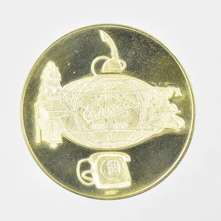 Jubileumsmynt L.M. Ericsson 100 år Ø 33mm 1876-1976 tillverkat av Sporrong originaletui 18K Vikt: 25,2 g