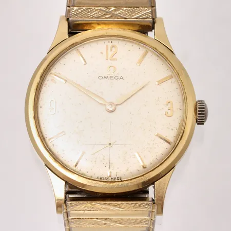 Herrur Omega i 18K guld, manuell, Ø34mm, ref 14707 62, cal 268, verlnr 19207049, flexband i gulmetall.