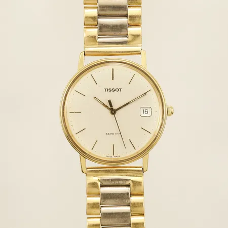 Herrur Tissot Seastar guld quartz armband gulguld/vitguld Ø33mm armband inklusive boetten 19cm repig batteribyte krävs 18K bruttovikt 106,1g Vikt: 106,1 g