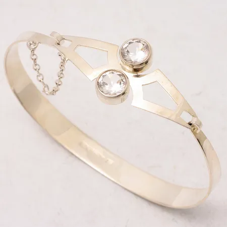 Armring 19cm, bredd 7,4-19,8mm, 2st vita stenar mått Ø7,5mm, Åbo Finland, 1974, silver 925/1000, 12,17g.