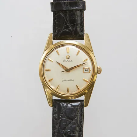 Herrur Omega Seamaster, guld på stål, automatisk, datum, 34mm, boettnr: 14701-3SC, caliber 562, verknr 17617655, svart läderarmband, inga tillbehör.