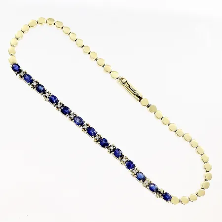 Armband diamanter 11 x ca 0,005ct blå stenar längd 18,5cm bredd 2,5-3mm 1 diamant saknas, slitage, synlig lagning, 14K. Vikt: 8,8 g