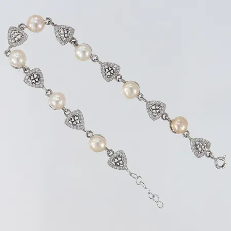 Armband vita stenar samt odlade sötvattenpärlor Ø6,5mm längd 17,5-19,5cm bredd 8mm silver 925/1000 Vikt: 9,3 g