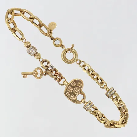 Armband med berlock längd 20cm bredd 5-13mm ihålig 18K. Vikt: 8,8 g