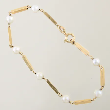 Armband med 7 odlade saltvattenpärlor längd 20cm bredd 5,5-2mm 18K Vikt: 5,3 g