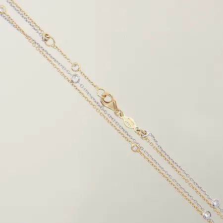 Collier med vita stenar 42,5-45cm bredd 1-3mm tvåfärgad 18K Vikt: 4,7 g