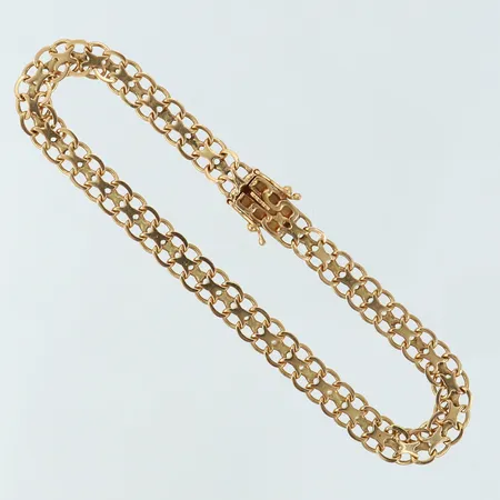 Armband X-länk längd 19,5cm bredd 6mm 18K. Vikt: 8,6 g