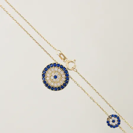 Collier med integrerade hängen längd 43,5cm bredd 0,6-13,5mm 2 stenar saknas 18K Vikt: 3,3 g